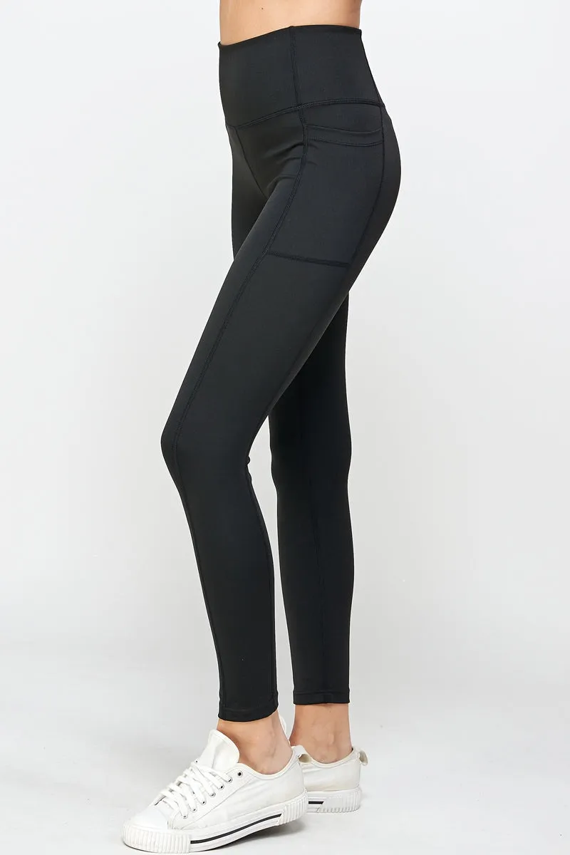 Black stretch leggings with side pockets