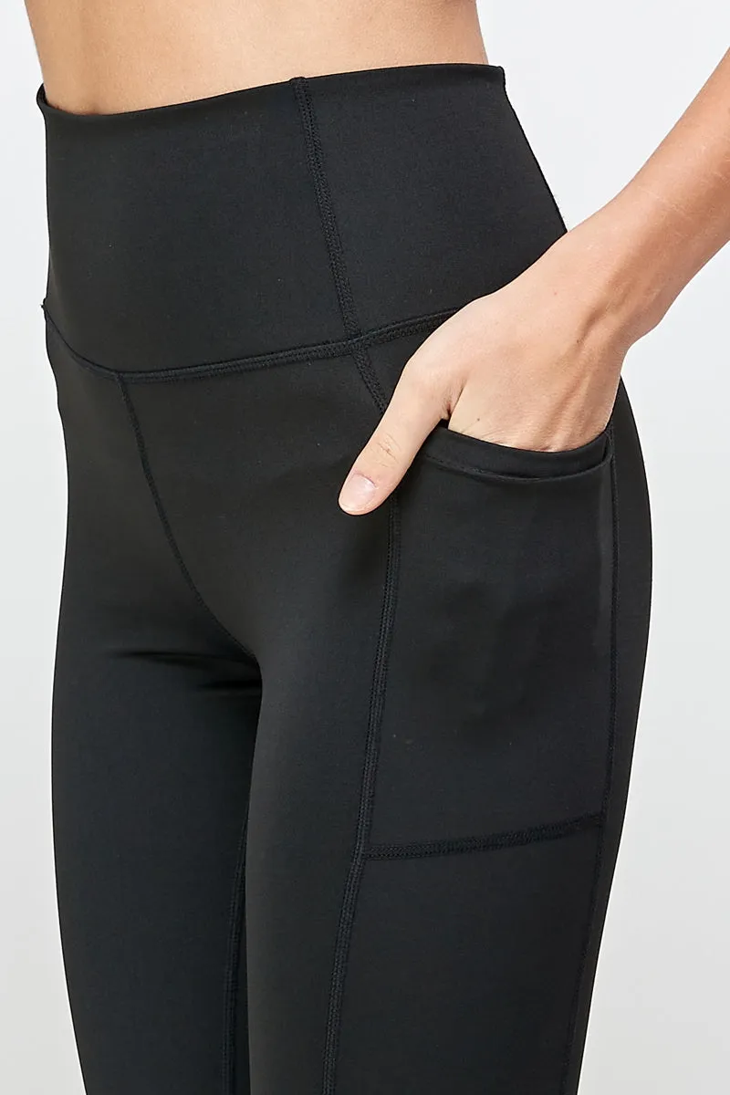 Black stretch leggings with side pockets