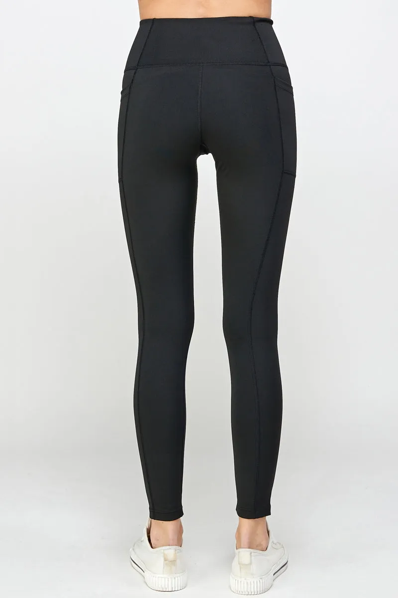 Black stretch leggings with side pockets