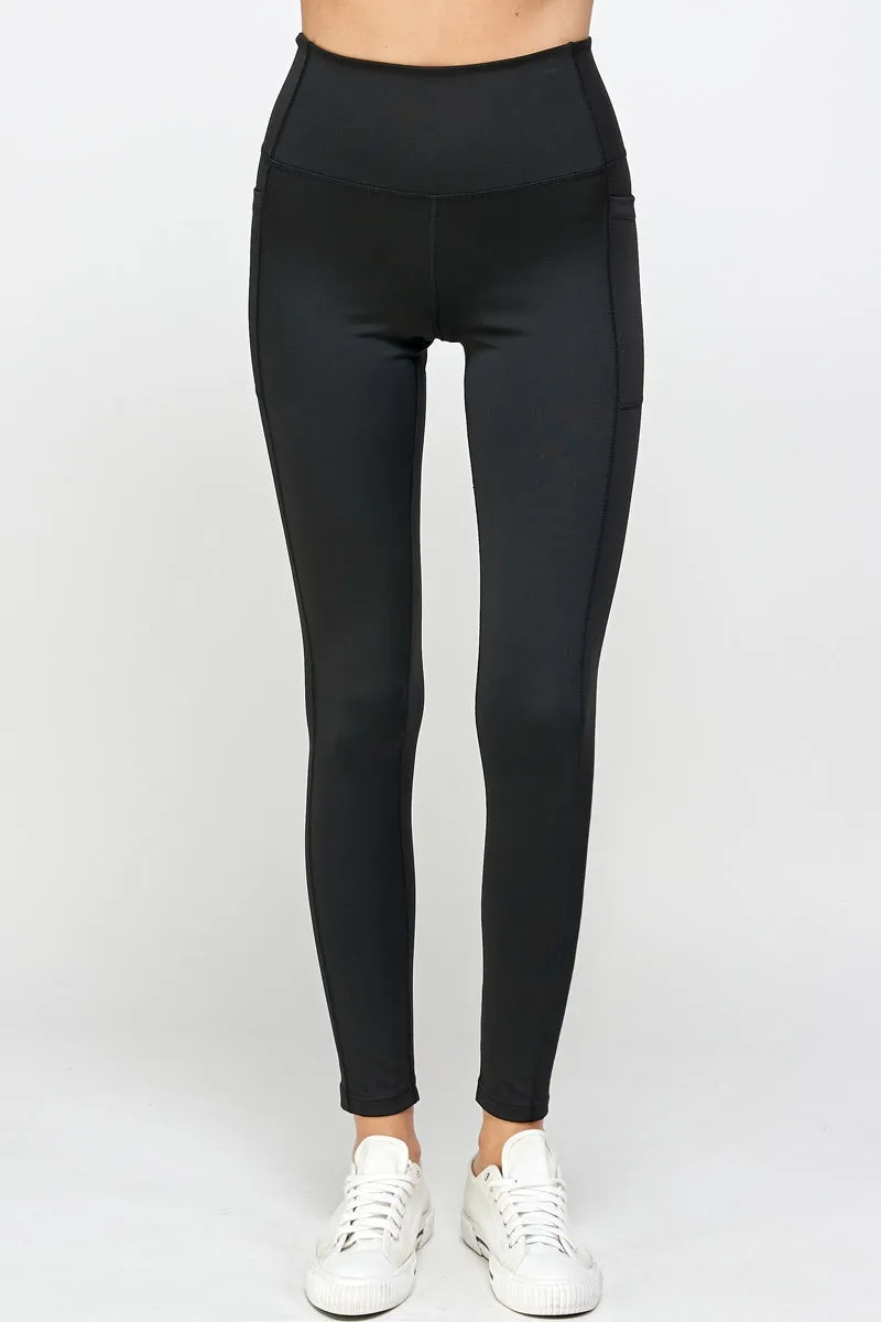 Black stretch leggings with side pockets